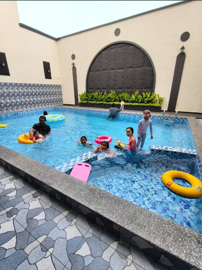 Families enjoying the private swimming pool