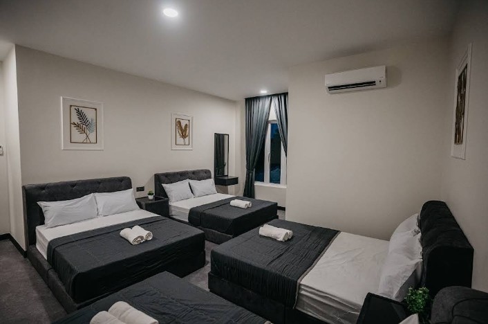 Spacious bedroom with multiple beds for larger groups