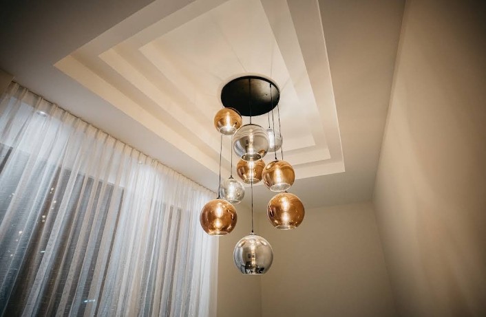 Designer chandelier with gold and glass spheres